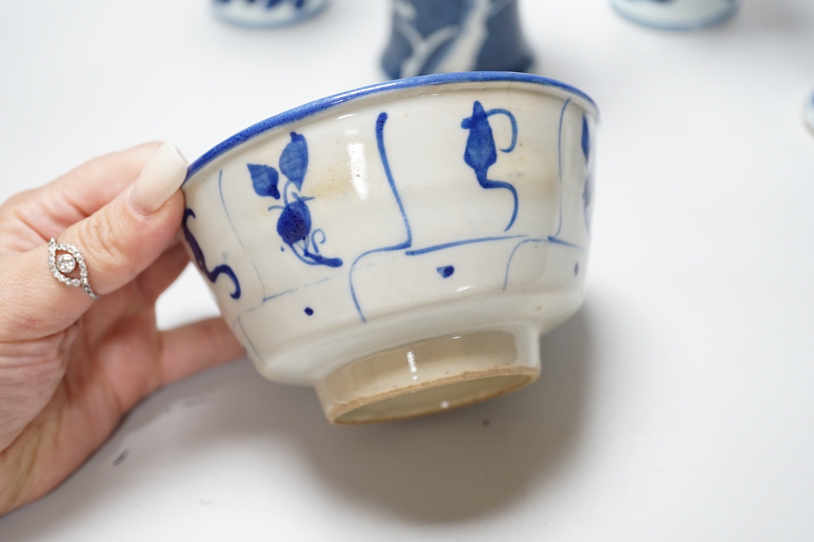 A group of Chinese blue and white ceramics including two prunus flower vases and three bowls, the largest 26cm in diameter